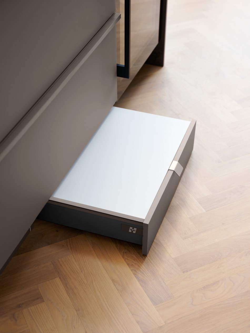 Gray kitchen drawer with light wood floor | HTH