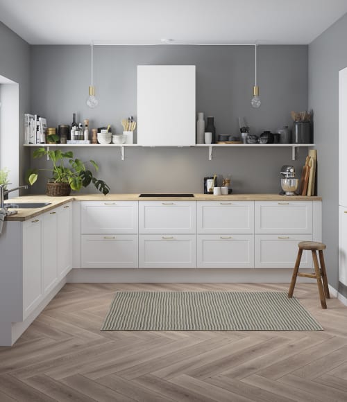White kitchen with wood countertop and gray walls. Model Art | HTH