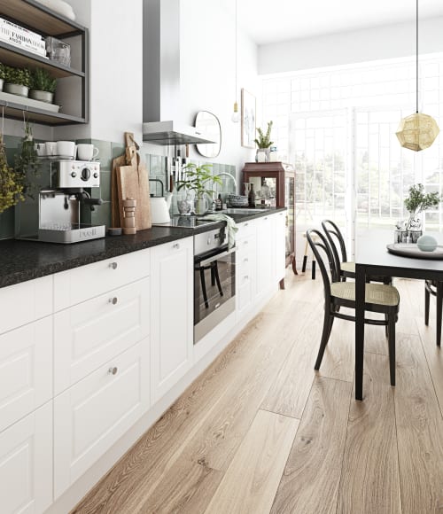 White kitchen cabinets with dark countertop and green tile backsplash. Sense Kitchen | HTH