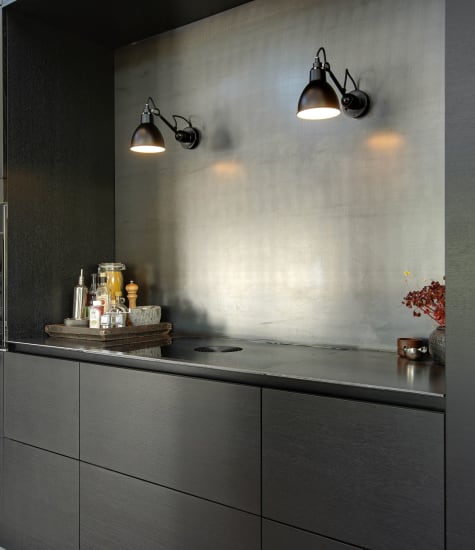 Dark kitchen cabinets with sleek design and integrated sink | HTH