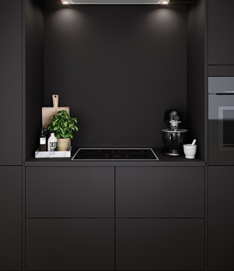 Dark kitchen with black cabinets and integrated oven. Focus Laminate | HTH