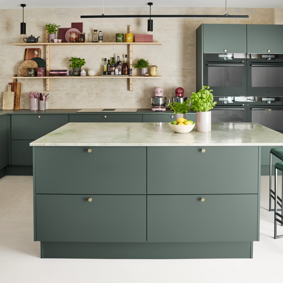 Green kitchen cabinets with island and barstools| HTH