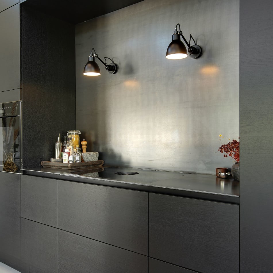 Dark kitchen cabinets with sleek design and integrated sink | HTH