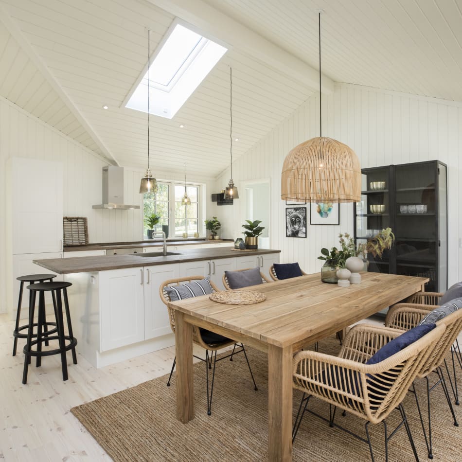 White kitchen with gray countertop and stainless steel appliances. Model Art | HTH