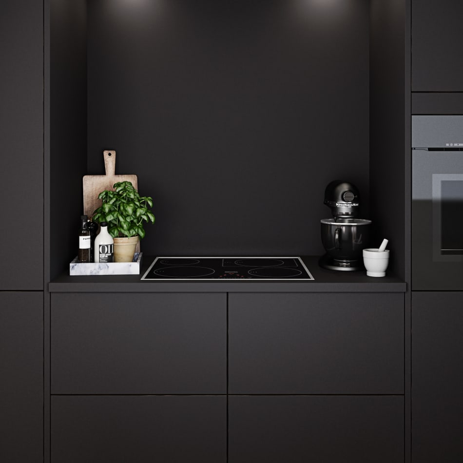 Dark kitchen with black cabinets and integrated oven. Focus Laminate | HTH