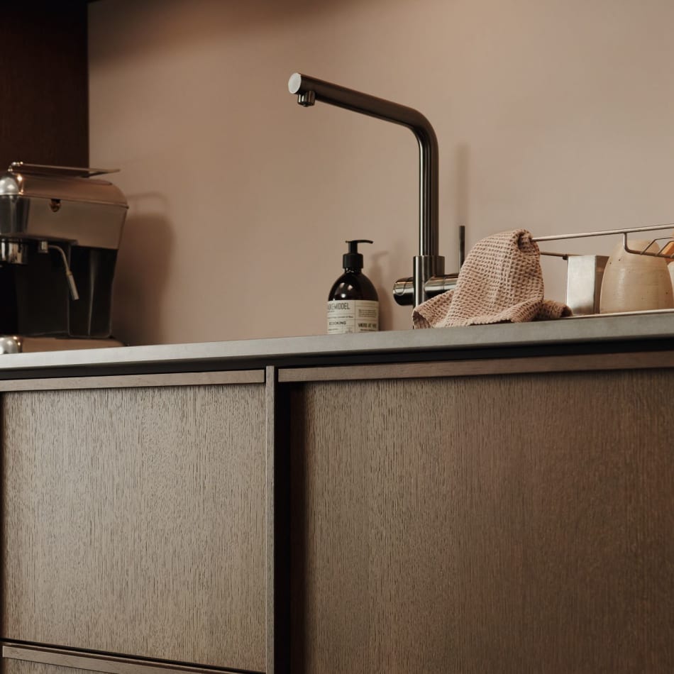 Wooden kitchen cabinets with gray countertop and stainless steel faucet. Nordic Atmosphere | HTH