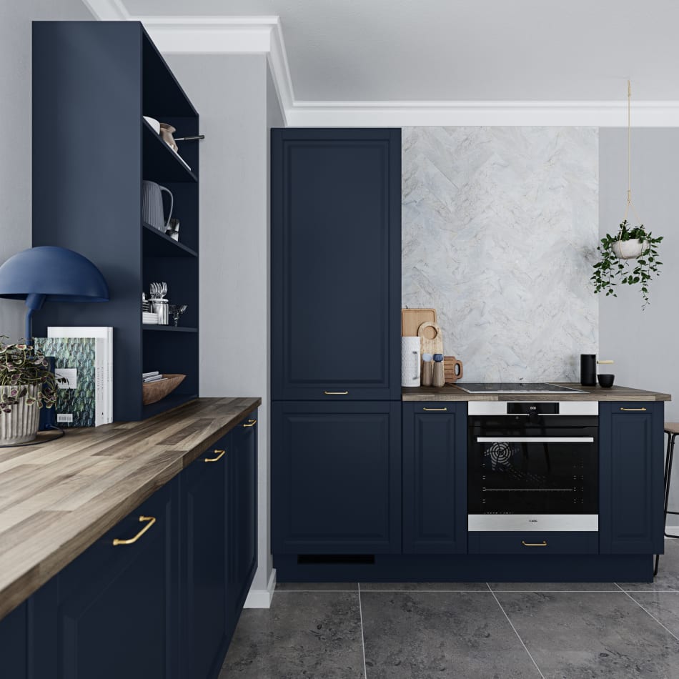 Navy blue kitchen cabinets with wood countertop and stainless steel oven. Scandinavian Classic | HTH
