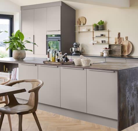 Contemporary kitchen featuring beige cabinetry complemented by dark wood details | HTH