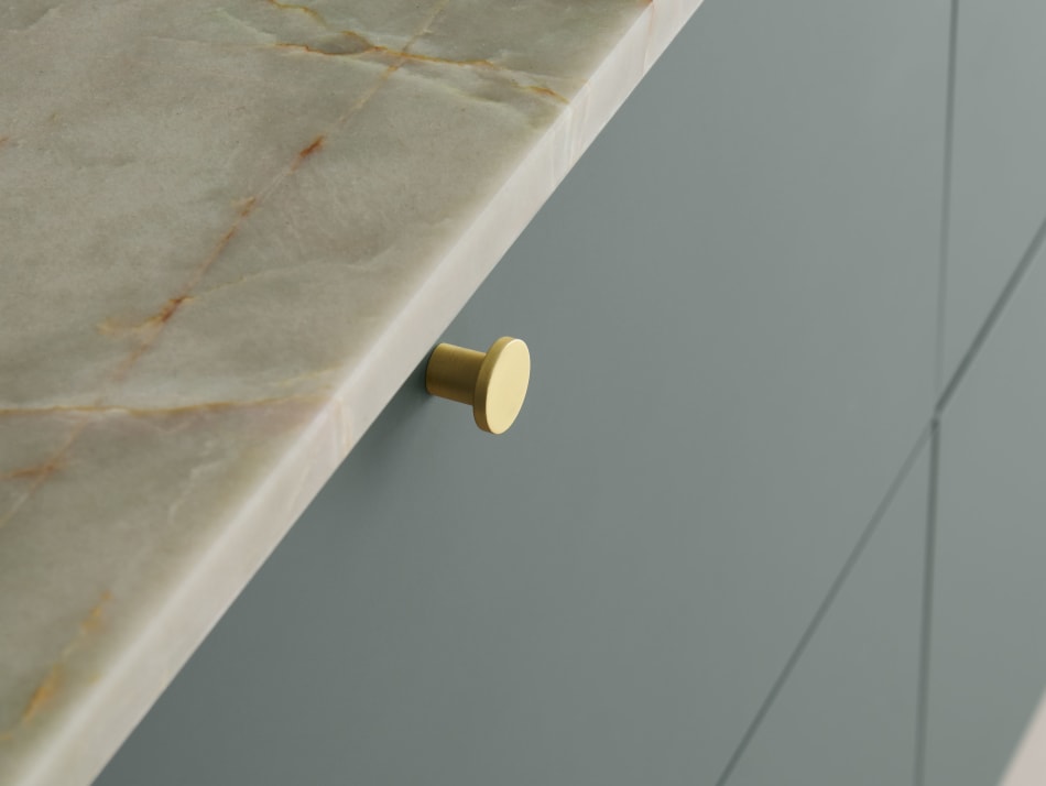 Green kitchen cabinet with marble texture countertop and gold handle | HTH