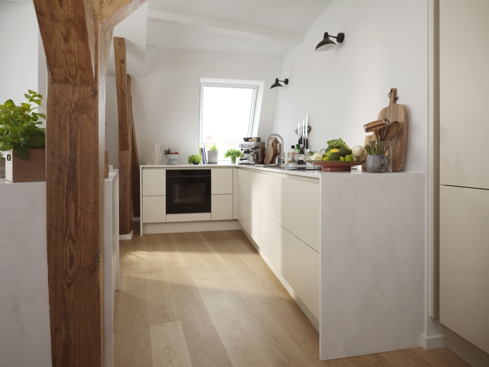 White kitchen cabinets with light wood flooring and wood beam detail | HTH