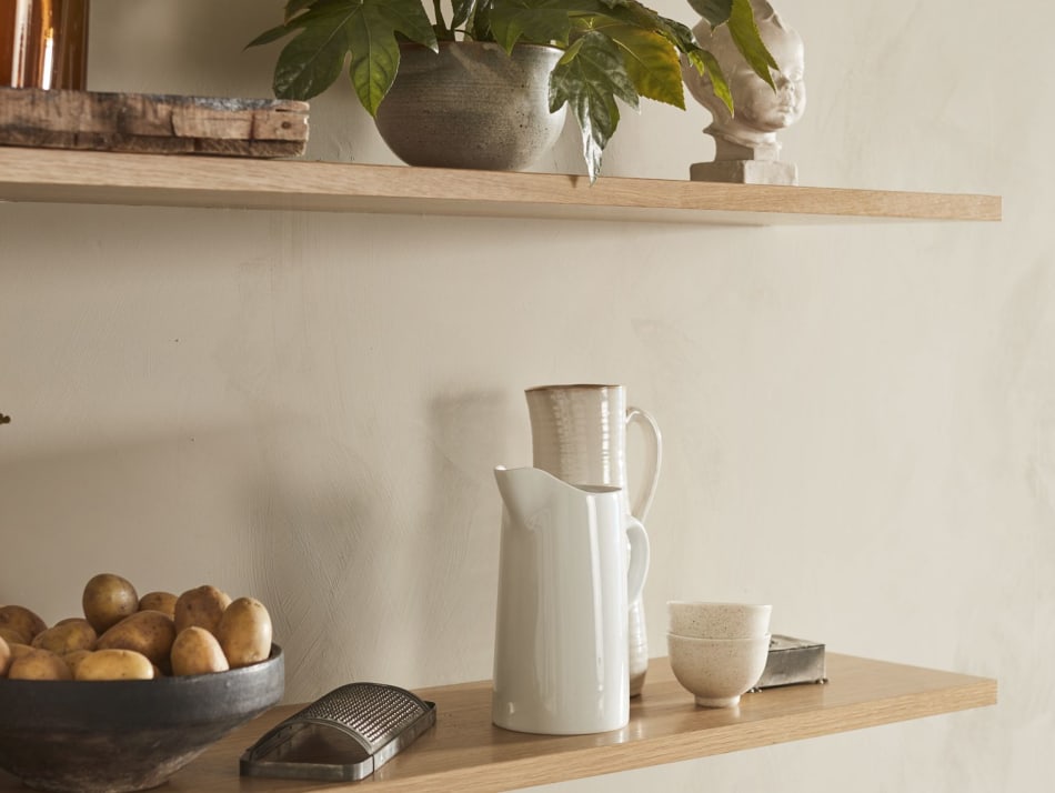 Wooden kitchen shelves with white ceramic items and plants | HTH