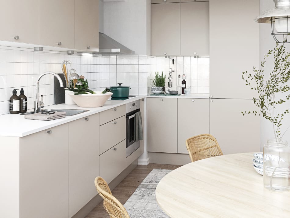 Beige kitchen cabinets with white countertop and tiled backsplash. Stockholm Kitchen | HTH