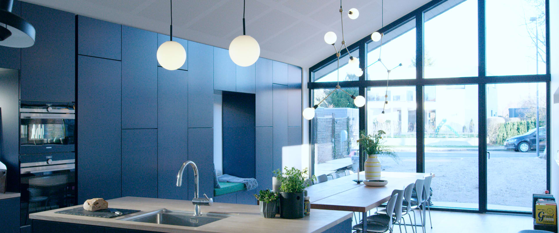 Blue kitchen cabinets with a light countertop and kitchen island | HTH