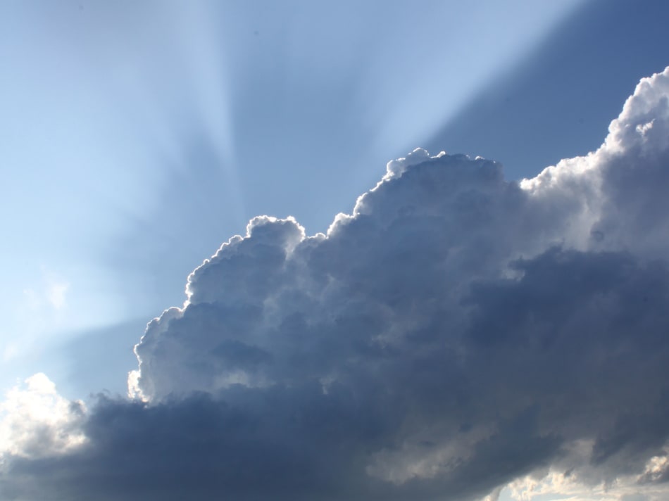 the sun is shining through the clouds in the sky