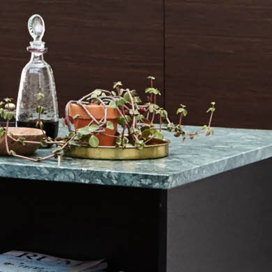Green kitchen island countertop with dark cabinetry | HTH