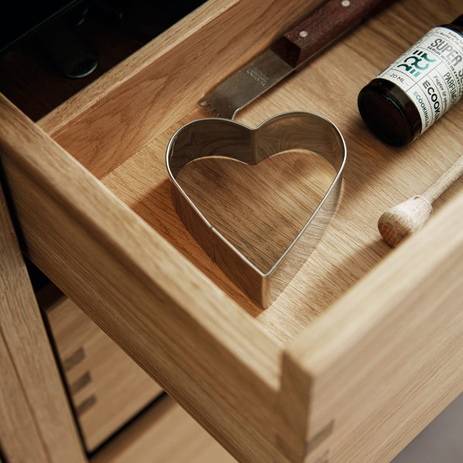Wooden kitchen drawer with heart-shaped cookie cutter inside. Nordic Creation | HTH